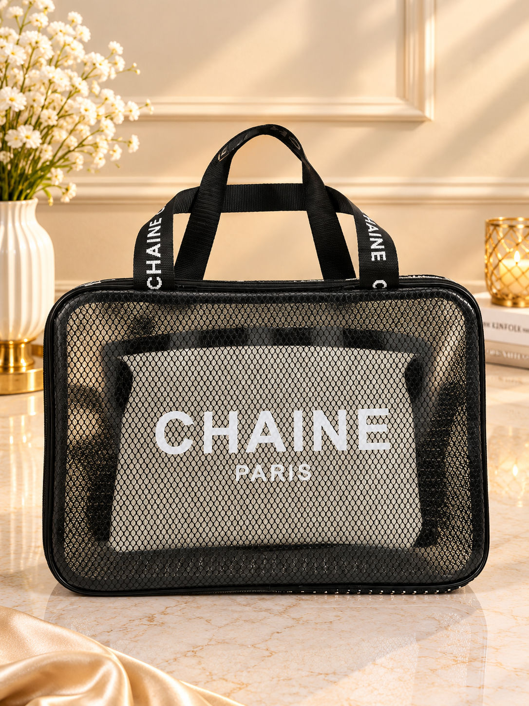 Black mesh and clear travel toiletry bag with CHAINE Paris logo and zipper
